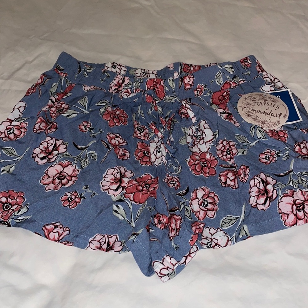 $5 FOR $20 NWT blue with pink flowers shorts.